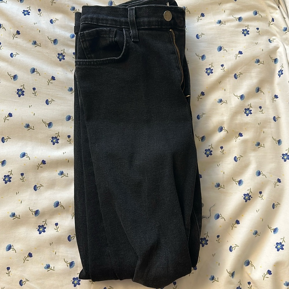 black jeans w holes in each knee